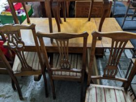 An oak extending dining table, on turned supports and splayed feet, 75 x 106 x 75.5cm (167cm when