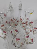 A Polish suite of enamelled glassware for Laura Ashley comprising 2 decanters with stoppers, 2 vases