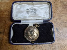 A late 19th/early 20th century gold plated locket, in a L Feitelson, Ilford jewellery box, weight of