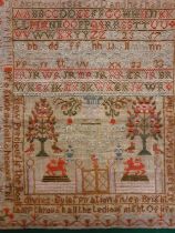 An mid 19th Century sampler, unframed, worked by Christina Robb June 1846 having garden scenes,