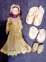 A Victorian American peg doll having a painted face with nose addition, 33cm high together with a