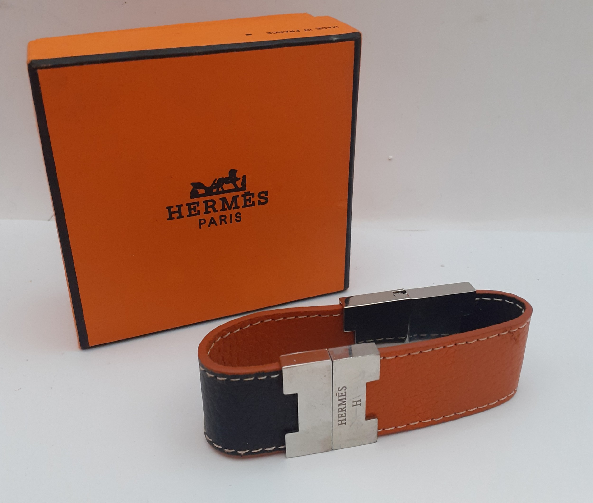 Hermes-A reversible brown and orange leather 'Leurie' wrist strap having silver tone hardware, - Image 2 of 5