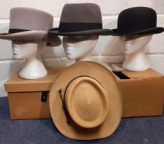 Four gents hats comprising a late 20th Century Windmill Textiles grey felt top hat with black band
