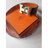 Hermes- A brand new gents Togo grain reversible noir/orange leather belt having a brushed gold