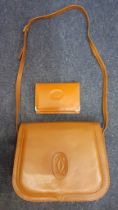 A vintage French tan brown leather shoulder bag and similar purse, no labels. Location: BWR