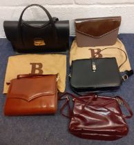 A group of mid to late 20th Century bags, mainly leather, to include a brown Bally clutch bag with