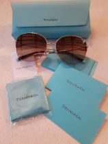 Tiffany-A pair of gold tone half framed sunglasses having brown ombre lenses, model no: TF3082