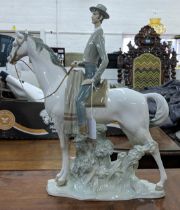 A Lladro figure of an elegant man in smart dress on horseback, Location:8.5