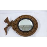 A 19th century carved giltwood mirror with a convex plate surmounted by an eagle, 65cm h A/F