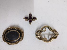 Group of early Victorian jewellery to include a gold plated and black finished mourning brooch,