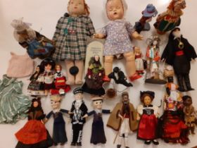 A collection of vintage dolls of the world to include a Chad Valley rag doll with green checked