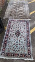 Two hand woven rugs to include an Indian floral design rug, 160cm x 94.5cm, and a Pakistani rug