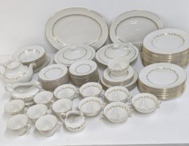 A royal Doulton Fairfax dinner service to include a pair of treen, teapot, sauce boat, two