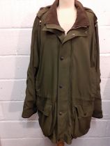 Barbour-A green breathable padded cotton country pursuit jacket having a drawstring waistband and