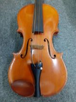 A 20th Century full size violin measuring 35.5cm back and 58cm total length, strings AF together