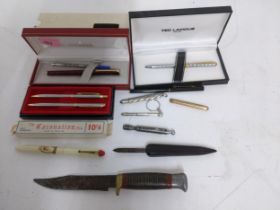 A lot of biro and propelling pencils to include Sheaffer, along with a Victorian quill cutter