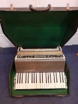 A 1980's German Hohner Verdi piano accordion with leather shoulder straps and case Location: RWF