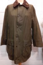 Barbour-A green 'Border' wax cotton coat having a brown cord collar with gold tone branded badge,
