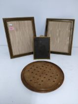 Two leather strut photograph frames, an early 20th century gilt metal photograph strut frame and a