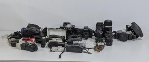 A quantity of photographic equipment to include a Canon Av-1, A Nikon F90X, a Pentax ME super and