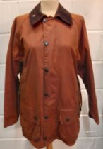 Barbour-A chestnut brown Beaufort wax cotton coat with brown cord collar, having 2 front deep