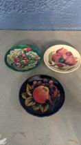 Three Moorcroft pin dishes to include Finches pattern dish, Leicester dish and Magnolia dish