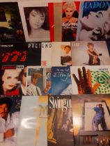 A quantity of mainly 1980's LP's and 12" singles to include Kate Bush, Wham, Michael Jackson,