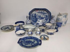 A mixed lot of blue and white ceramics to include a 19th century large Willow pattern dish with twin