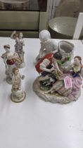 19th century and later porcelain figures to include a pair with a woman holding a bird, a woman with