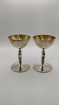 A pair of silver designer cups with pierced stems 39.3g hallmarked London 1975 Location: