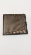 A silver cigarette case having a ribbed design hallmarked Birmingham 1933, 129.8g Location: