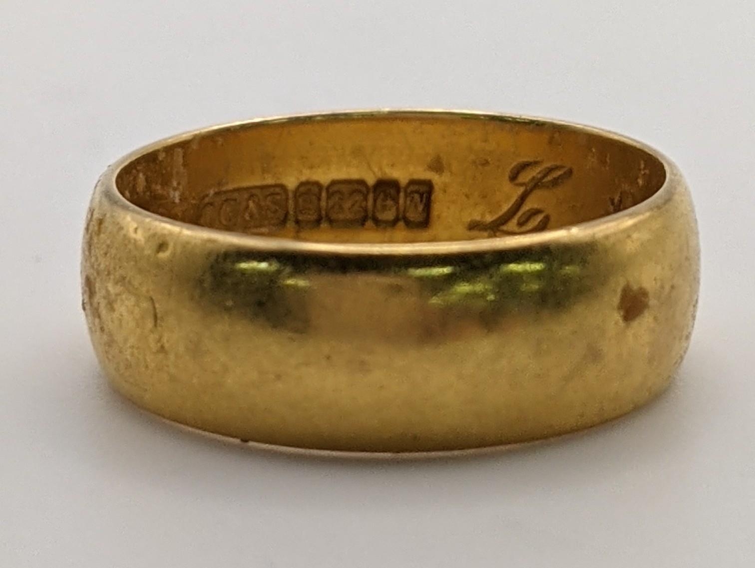 A 22ct gold wedding ring, 4.2g, Size H 1/2 Location: