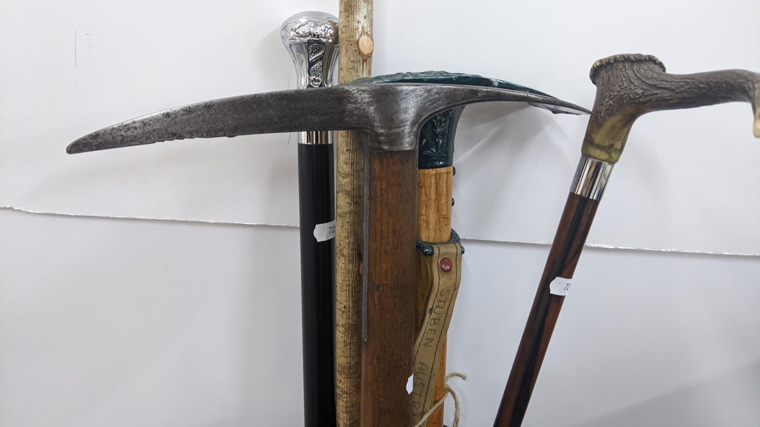 A fur and leather stick stand containing walking sticks and pick axes to include a horn handled - Image 2 of 4