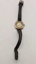 A 9ct gold ladies manual wind wristwatch, on a brown leather strap, total weight 15.5g, Location: