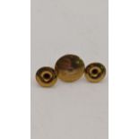 A pair of 18ct gold studs 1.45g and a 9ct gold stud Location: