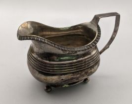 A silver milk jug on four ball feet, 145.2g, Location: