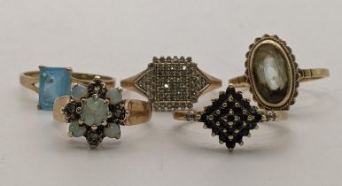 Five 9ct gold rings to include an opal and diamond flower head ring A/F, together with a 9ct and