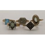 Five 9ct gold rings to include an opal and diamond flower head ring A/F, together with a 9ct and