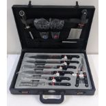 A Prima cased set of knives in a black leather travel case Location: