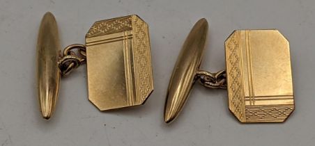 A pair of 9ct gold chain cufflinks, each with engraved design and chain links, 4.1g Location: