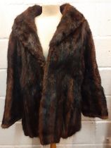 A vintage sable fur jacket having a shawl collar and 2 front pockets and flared sleeves, 40" chest x