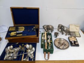 A mixed lot of silver plate to include a cased christening set, two models of elephants, mixed