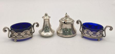 Four silver condiments to include a pepper pot, a mustard pot, a pair of pierced pots having