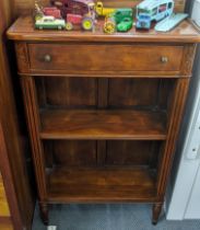 A reproduction mahogany French style open bookcase having a single drawer above two open shelves