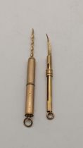 Two 9ct gold retractable, toothpicks, 7.6g Location: