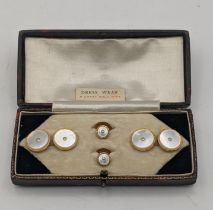 A set of 9ct gold rimmed and mother of pearl cufflinks and collar studs 7.3g Location: