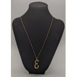 A 9ct gold necklace with an 'E' pendant, 3.9g Location: