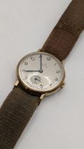 A 1950s Smiths 9ct gold manual wind wristwatch, having an engraved case back Location: