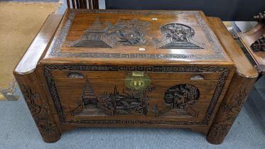 A Chinese vintage camphor wood chest carved with various landscape scenes 54cm h x 100.5cm w