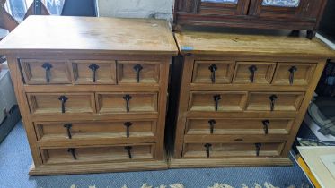 A pair of modern pine seven drawer bedside chests Location: